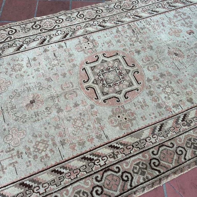 Elegant and ethereal, this antique Khotan rug offers a lighter, more delicate interpretation of Central Asian design....