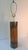 A handsome vintage Mid-Century Modern table lamp with a streamlined cylindrical oak body framed by brass-tone metal bands....