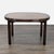 This Drexel dining table features a beautiful oval shape and a classic dark wood finish. The table is expandable, making...