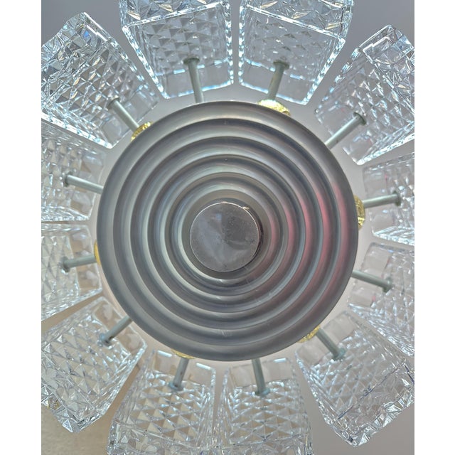 Beautiful mid-century design. Large 1970s chandelier made by the German company Kaiser Leuchten. Gray metal base with...