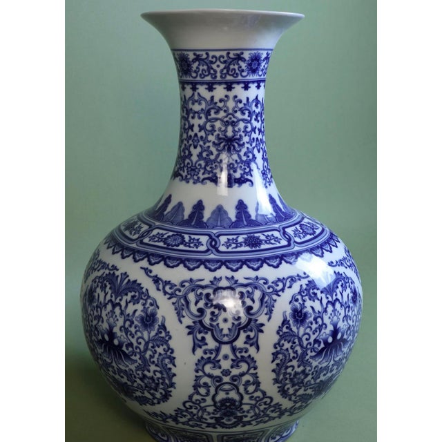 A striking and monumental vintage Chinese blue and white porcelain "Tianqiuping" (Celestial Sphere) globe vase. Standing...