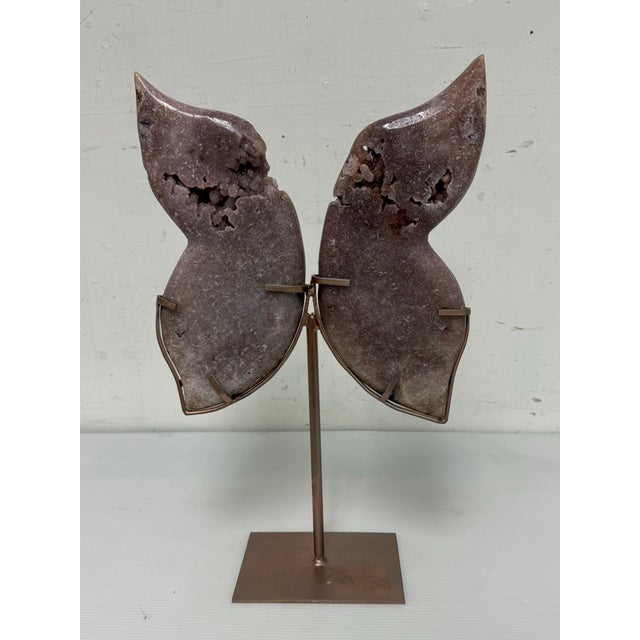 Design Plus Gallery presents a Pink Amethyst Butterfly on Stand. This sculptural mineral specimen is formed from matched...