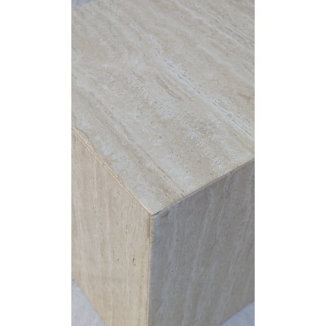 Pure, geometric, and heavy. This travertine cube is the ultimate multitasker for the modern home. Use it as a low-profile...