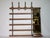 Super stylish wall coat rack made of metal and teak with a mirror. Manufacturer: Schöninger Epoch: 1960s Height: 131 cm...