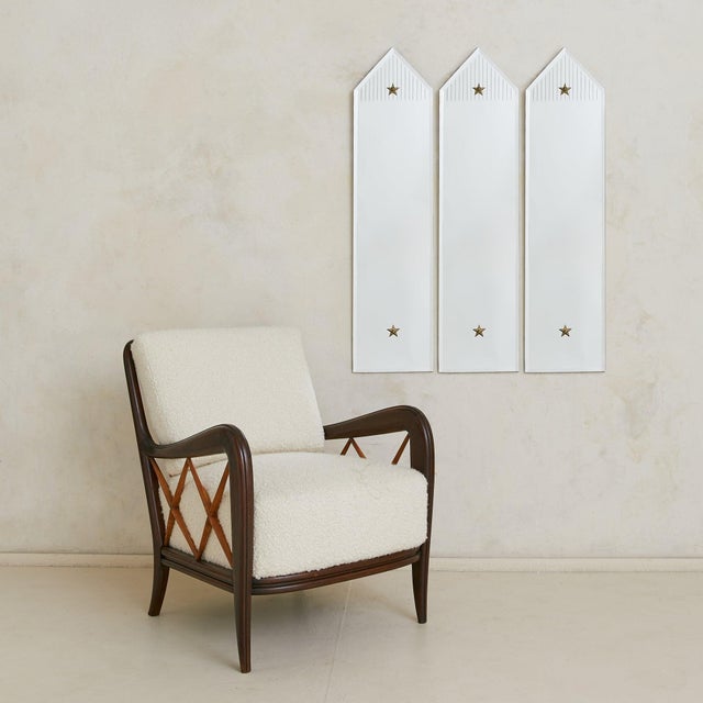 An Italian wall mirror from the 1960s, edged in a beveled border that catches light with subtle dimension. Its elongated...