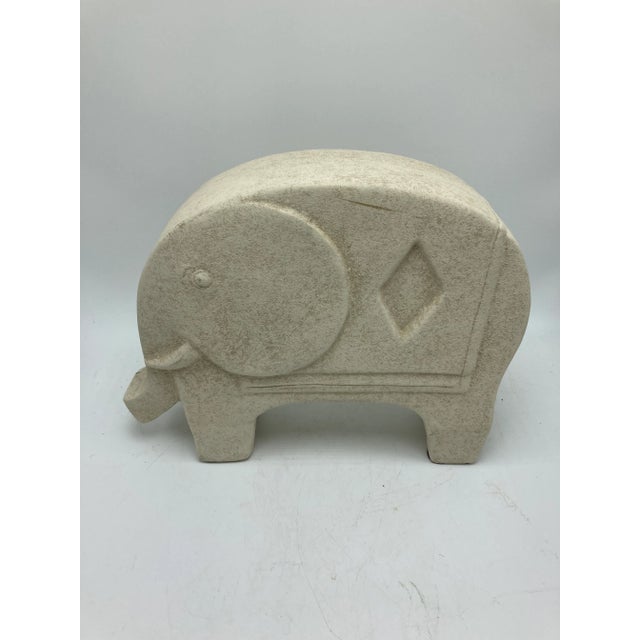 Simple and chic, this elephant is very modern in style! The look of stone but in a plaster
