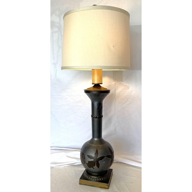 Great vintage Chinoiserie table lamp from the 1970's. It is made of mixed metals with a raised koi fish designs. The...