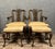 Pair of english armchairs with mahogany footrests, circa 1850, with openwork and carved backs upholstery and webbing in...
