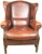 A mid 20th century English wing chair of a very large size. It is completely original in all respects including the...