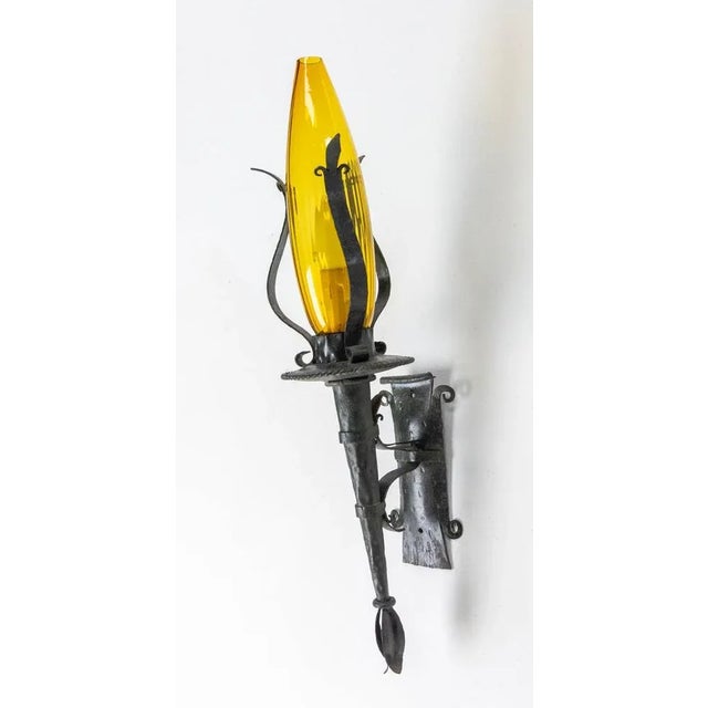 French outdoor light lanterns pair of exterior wall sconces wrought iron and amber glass The inside of the glass is...