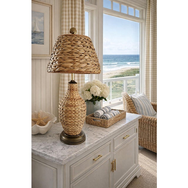 Offering a restored seagrass wicker table lamp & shade, circa 1960s. This gorgeous coastal seagrass lamp is authentic to...