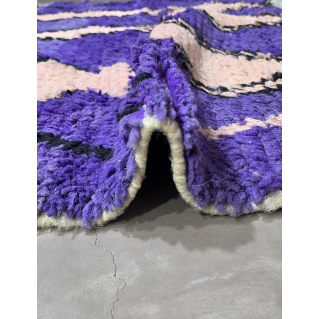 Modern Boujad Rug | Handwoven Wool Rug in Blue & Purple with Totem Figures This striking modern Boujad rug moves through...