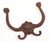 Antique Victorian style hall tree hook made of cast iron with a very rusted black finish. The original mounting hardware...