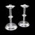 This is a pair of vintage candlesticks. An English, silver plated candle nozzle with later snuffer tool, dating to the mid...