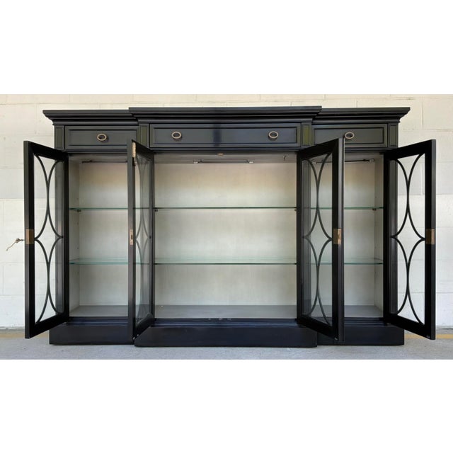 Original retail $9136, stylish Jonathan Charles Transitional Black Breakfront/Display Cabinet, four glass doors, three...