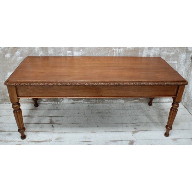 A Superb Victorian Centre Table. Made from fruitwood, designed with a simple hand carved frieze surrounding the table top,...