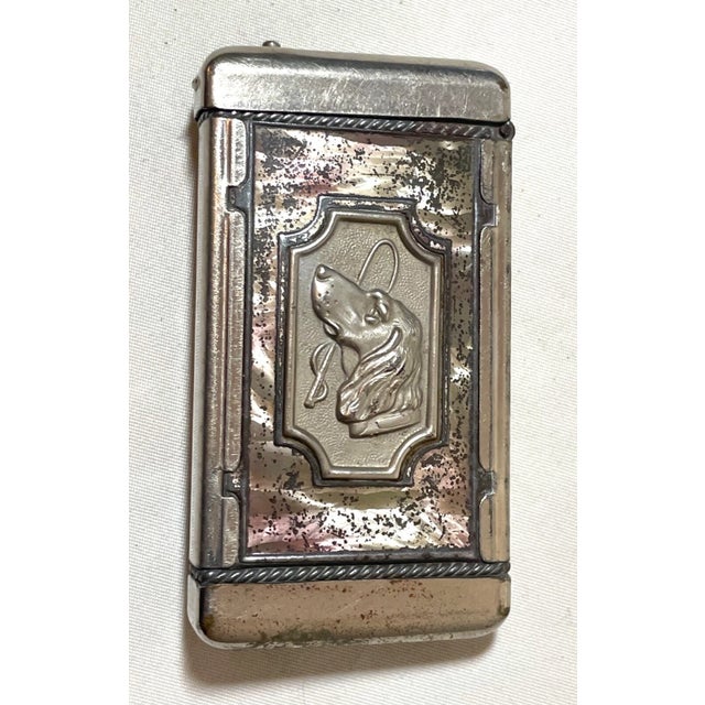 Up for sale is a wonderful antique figural match safe. It's done out of a silver toned metal along with a faux mother of...