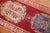 Vintage Turkish Oushak runner with three medallions on a bright red field. Measures: 3' x 10'9''.