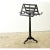 A French ebonized duet stand made in the 1800s. This antique was built for duet performances with back-to-back sheet music...