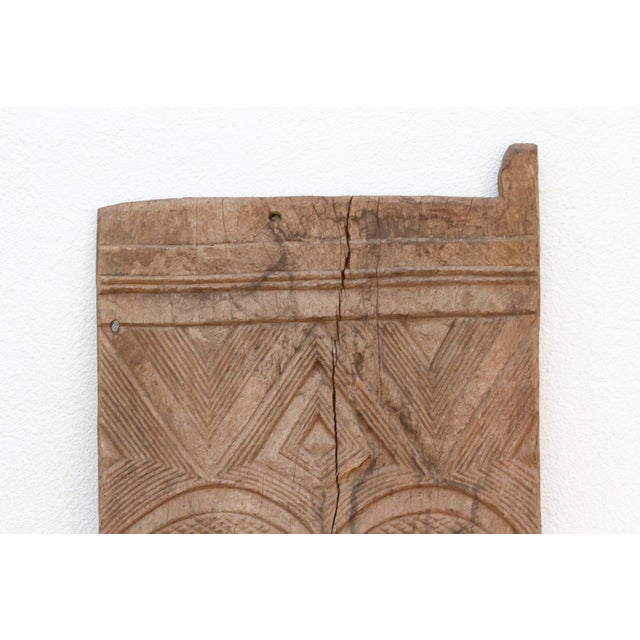 Early 20th Century Antique Bleached Wood Solar Eye Carved Igbo Door For Sale - Image 5 of 7
