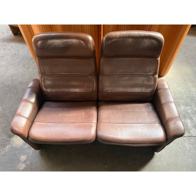 This DS-50 sofa was made in the 1970s by De Sede in Switzerland, and feature a solid wooden frame upholstered with thick...