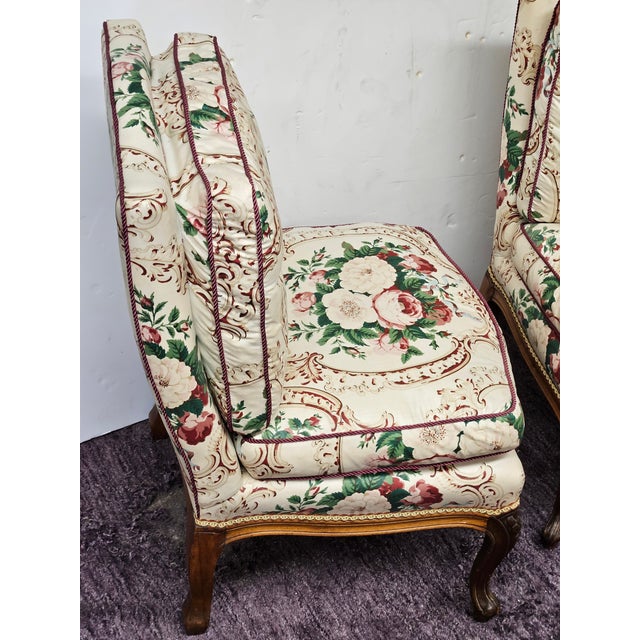 Charming tiny slipper chairs in Glazed chintz on Walnut frames. Attached down seat and back cushions.