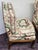 Charming tiny slipper chairs in Glazed chintz on Walnut frames. Attached down seat and back cushions.