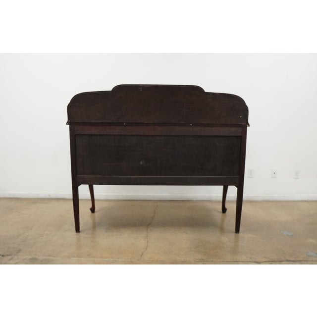 This vintage mahogany buffet server showcases classic traditional styling with elegant Queen Anne legs and a beautifully...