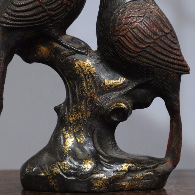 This exquisite piece depicts a pair of songbirds perched on a gnarled branch, their heads tilted toward each other as if...