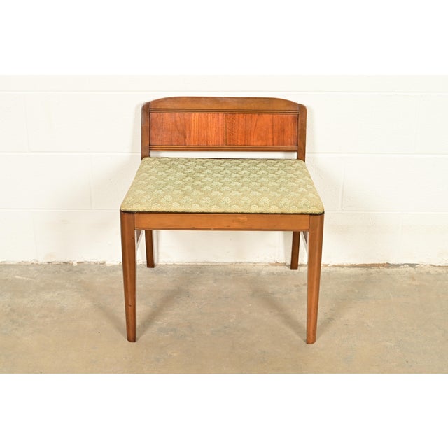 A gorgeous antique Art Deco style vanity bench or stool USA, Circa 1920s Carved walnut, with upholstered seat. Measures:...