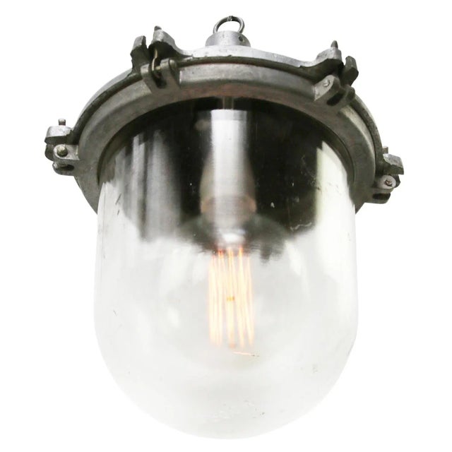 Industrial hanging lamp. silver grey cast aluminium, clear glass. e27 / e26 depending on destination, all lights are...