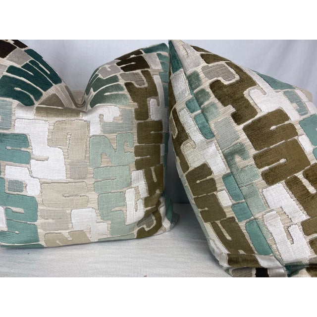 Custom pair of 22" pillows covered in a cut velvet fabric in turquoise, bronze and cream. These pillows have tapered...