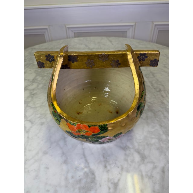 Elevate an entryway console or formal dining table with this stunning vintage Japanese Kutani porcelain flower basket...