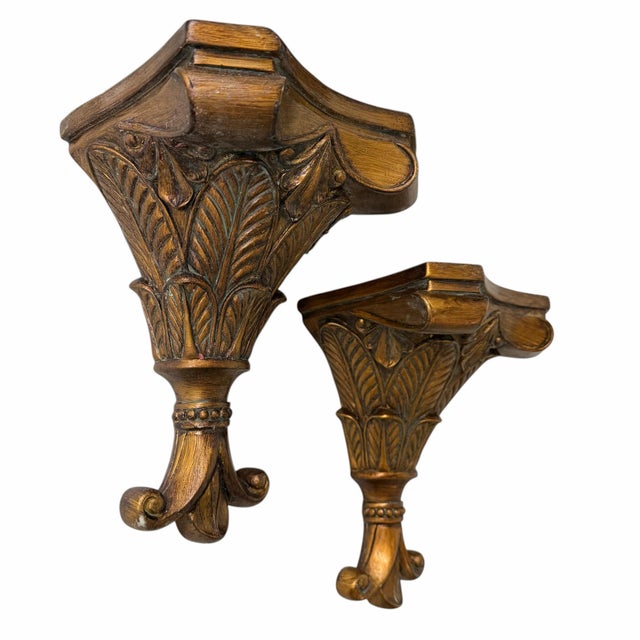Burnished gold decorative wall brackets. Beautiful way to display your collections. Each measures 7” w x 5” d x 11” h.