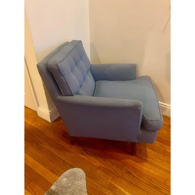 Vintage mid-century modern accent chair in powder blue fabric upholstery with tapered wooden legs. Purchased from Furnish...