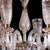 An elegant Osler-style cut glass chandelier of finely proportioned form, centered by a shaped baluster standard richly...