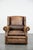 We are offering this luxurious, large, and well-maintained English-style cowhide wing chair in a beautiful color scheme....