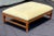A refined teak “Hameau” bench designed by John Hutton for David Sutherland, a brand synonymous with luxury indoor/outdoor...