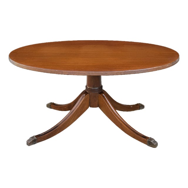 Vintage Duncan Phyfe Style Mahogany Oval Coffee Table – Federal Neoclassical Pedestal Base With Reeded Saber Legs & Brass Claw Feet For Sale