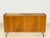 This charming vintage sideboard from the 1960s captivates with its distinctive oak grain and inviting, warm wood tone. The...