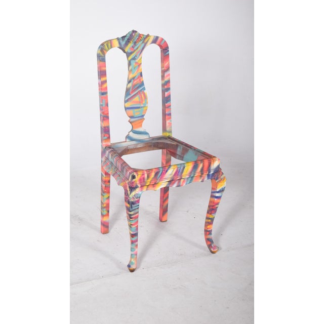 Painted dining chair. with decorative carvings on the upper edge, it has been decorated with contemporary multicolored...