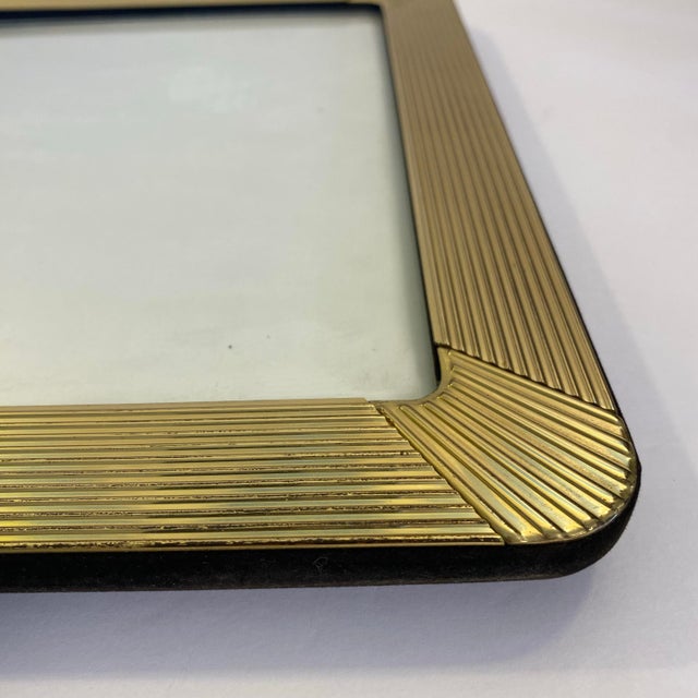 Art Deco meets Hollywood Regency in this fantastic vintage find from the 1980s. The front is a fluted gold tone metal that...