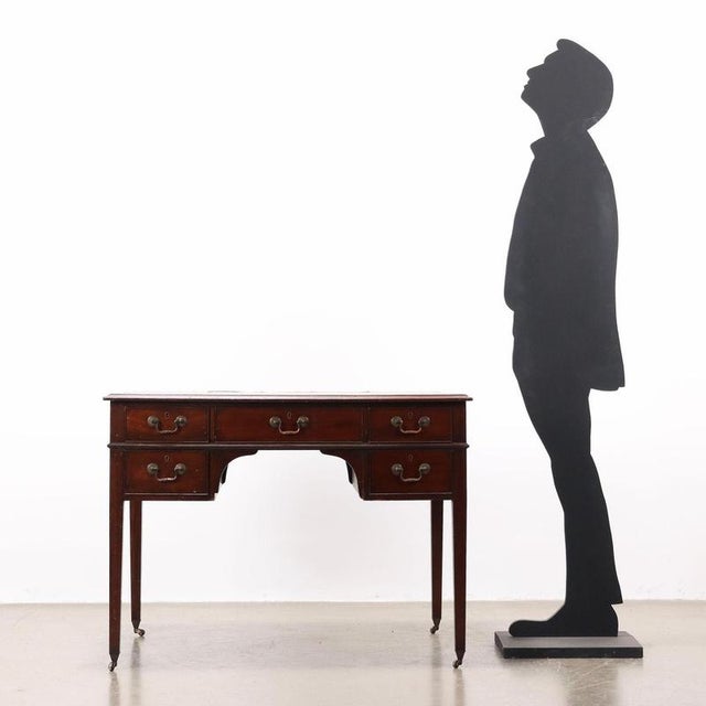 Directory desk in mahogany, front with five drawers, three of which are in the under-counter area, truncated pyramid legs,...