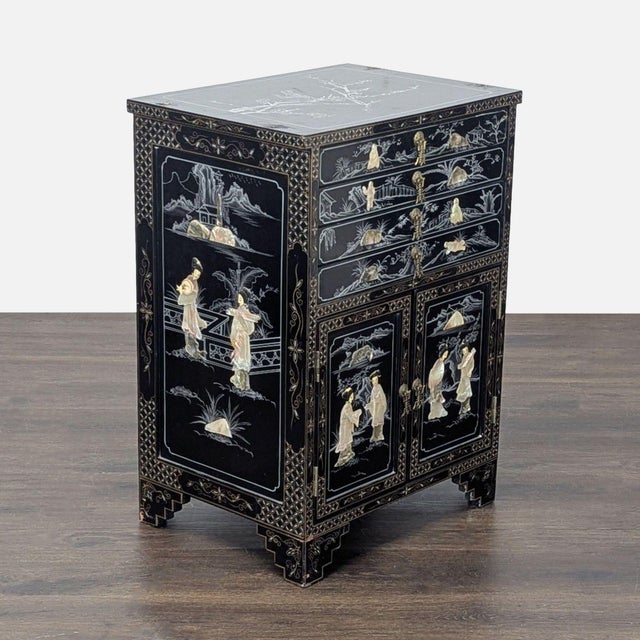 This elegant Chinese cabinet features a classic black lacquer finish with detailed mother-of-pearl inlay designs on the...