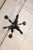 A French three-light iron chandelier from the mid 20th century. This vintage forged-iron chandelier from France features...