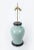The celadon in ancient Chinese porcelain has a great influence in the world. The table lamp made of this celadon vase has...