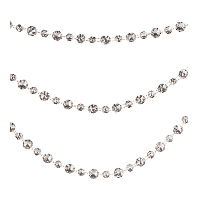 Add a touch of sparkle and elegance to your holiday décor with this Crystal Bead Triple Strand Garland Ornament Set....