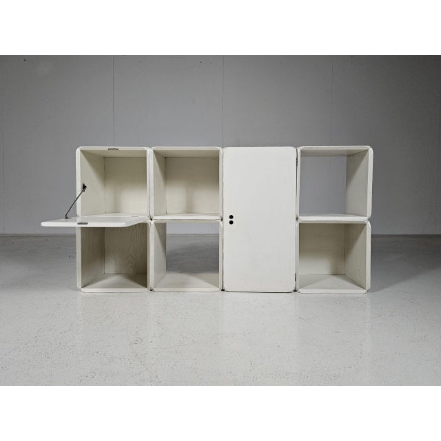 Modular wooden Samara storage wall unit in cream white painted wood by Dutch designer Derk Jan de Vries, created in the...