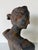 Classic antique cast iron bust depicting Diana, the Roman goddess of the hunt, captured in a graceful side profile with...
