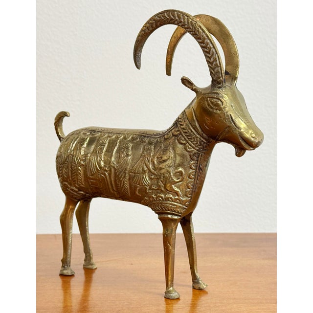 Vintage etched brass ram figure depicting Royal scene to body. Decorative elements to neck and back. Majestic etched...